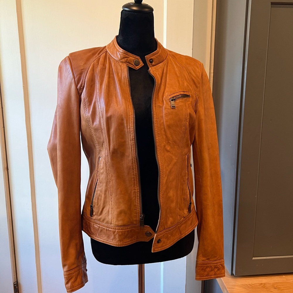 Cognac colored 100% real leather jacket.